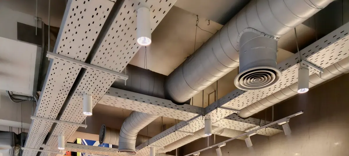 Exposed ceiling services and ductwork in a modern office fitout